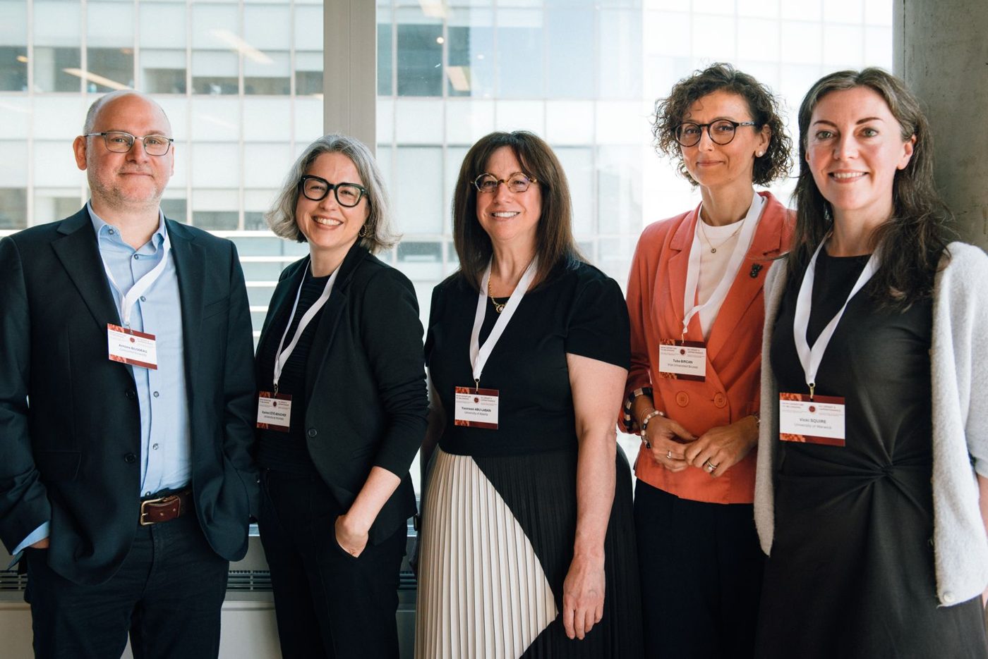 Tuba Bircan standing with four fellow speakers at Concordia University